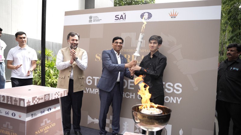 Ceremonial Torch Handed to Uzbek GM Javokhir Sindarov by AICF President Nitin Narang Ahead of Chess Olympiad 2026 decoding=