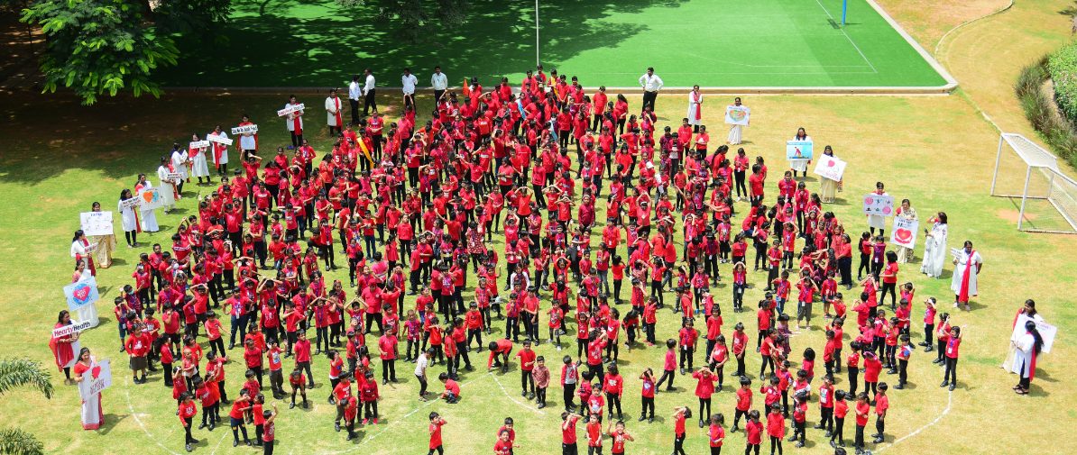 Ujjval World School Children Form Human Heart to Promote Healthy Heart on World Heart Day decoding=
