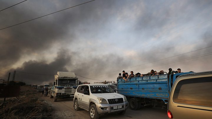 Tens of thousands of civilians flee Turkish offensive in Syria decoding=