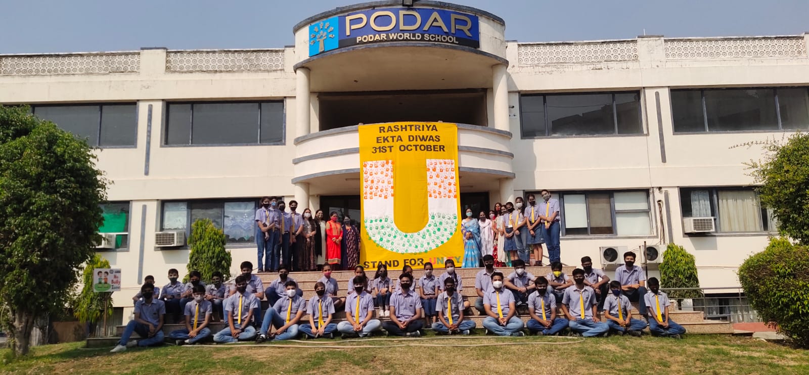 Students of Podar World Schools celebrated the National Unity Day by making a large-sized cut-out with a message of ‘U for Unity’ decoding=