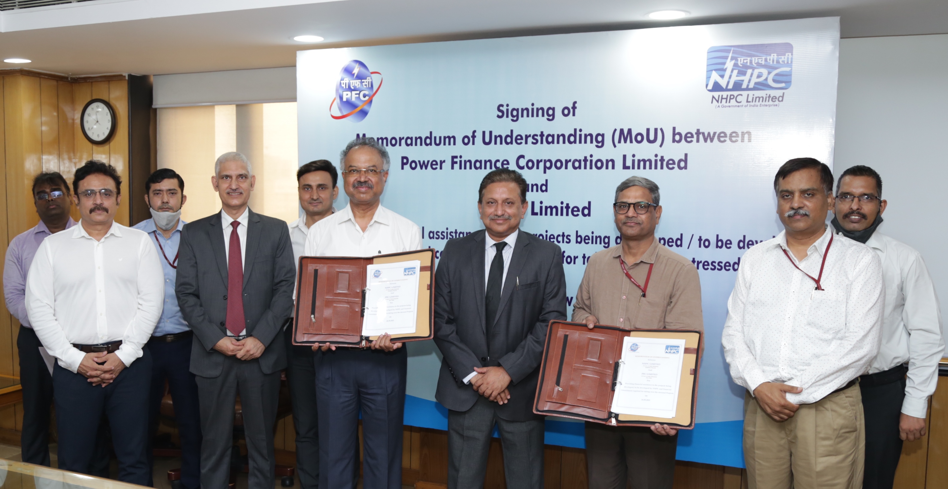 PFC in pact with NHPC to lend funds for the development of hydro projects decoding=